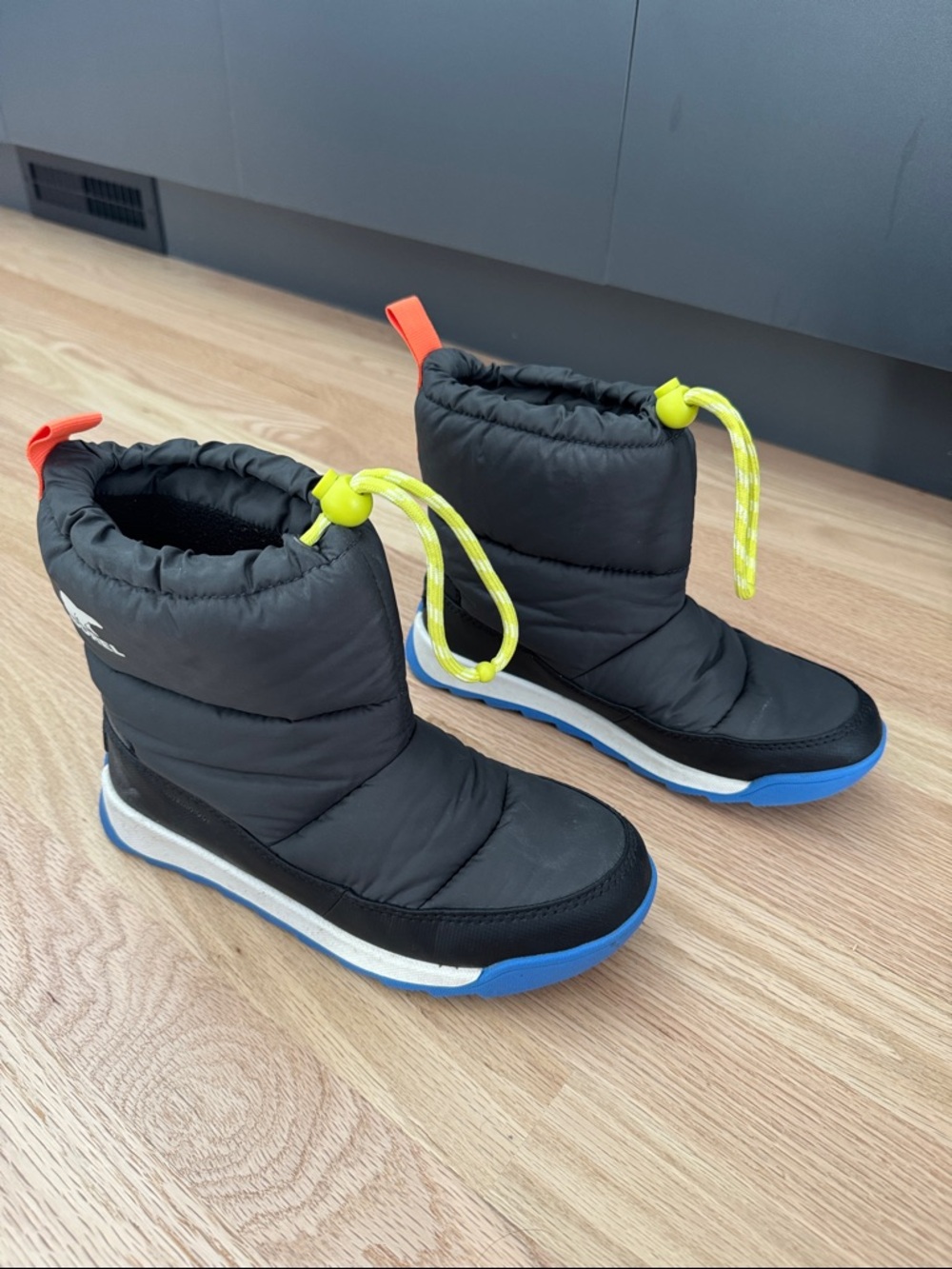 Sorel Kids Black Snow Boots with Blue Sole and Neon Yellow Laces